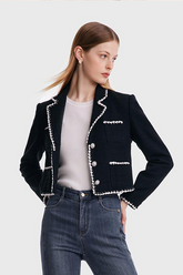 a lady in black cropped jacket with white t-shirt